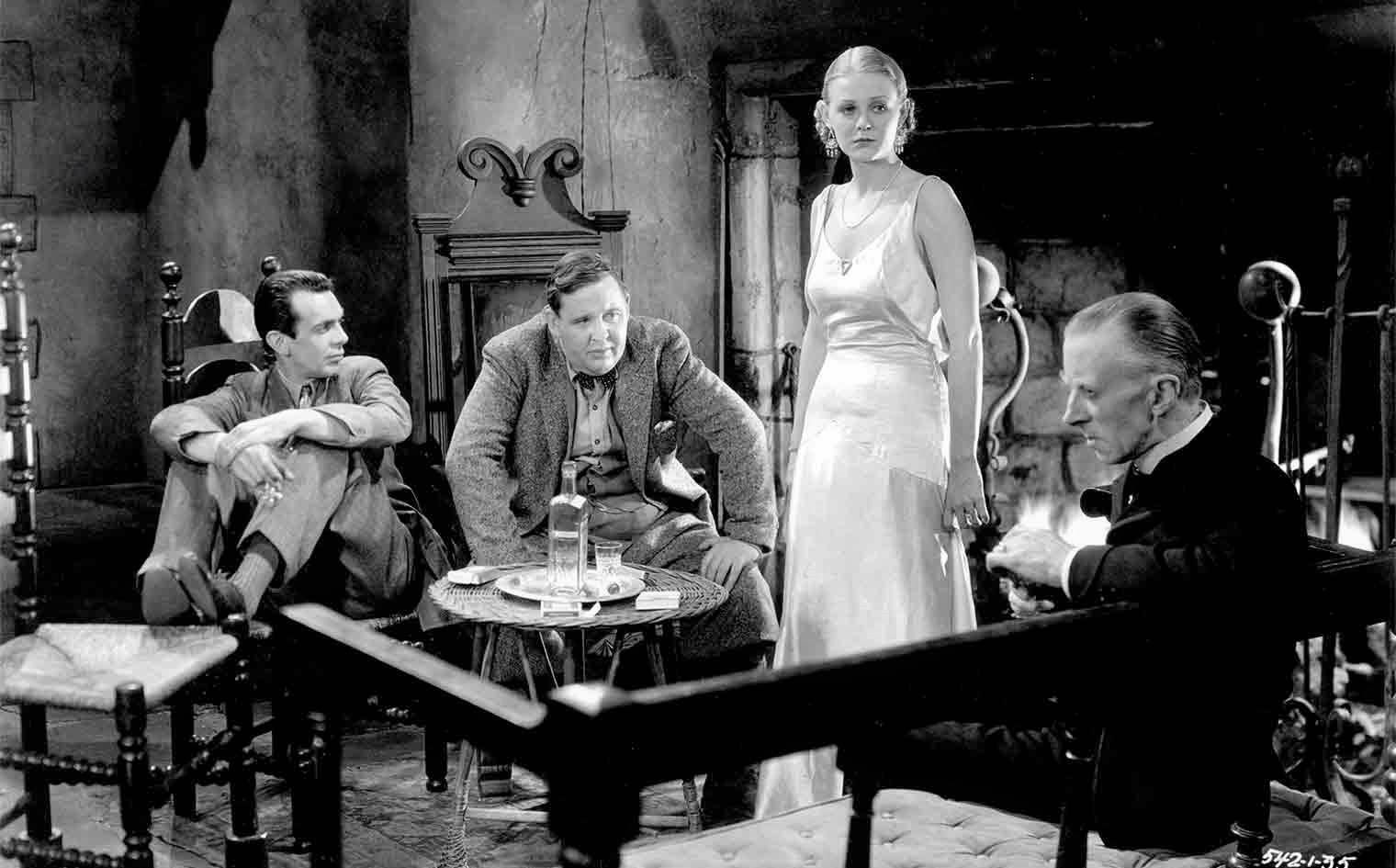 The visitors to the Femm house - Melvyn Douglas, Charles Laughton, Gloria Stuart and host Ernest Thesiger in The Old Dark House (1932)