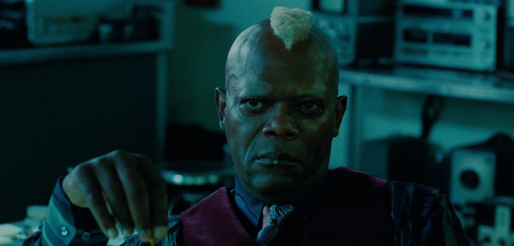 Samuel L. Jackson as the mohawked controller of the prison in Oldboy (2013)