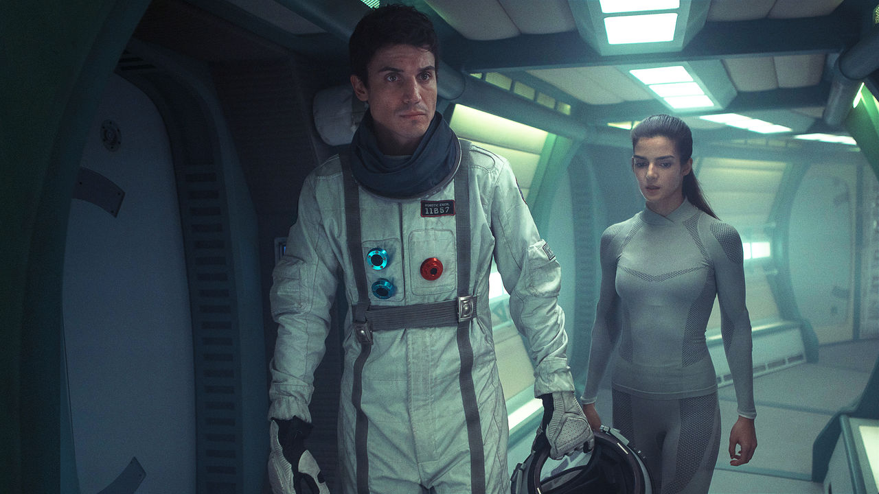 Helena (Clara Lago), lone girl on a space mission and Alex (Alex Gonzalez), the first other person she has met in Orbiter 9 (2016)