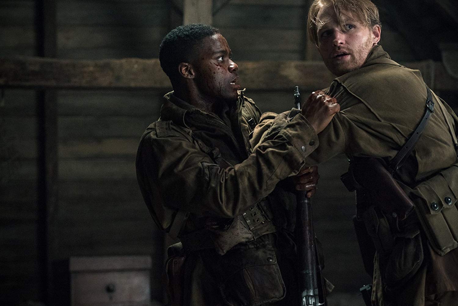 Jovan Adepo and Wyatt Russell try to survive behind enemy lines in Overlord (2018)