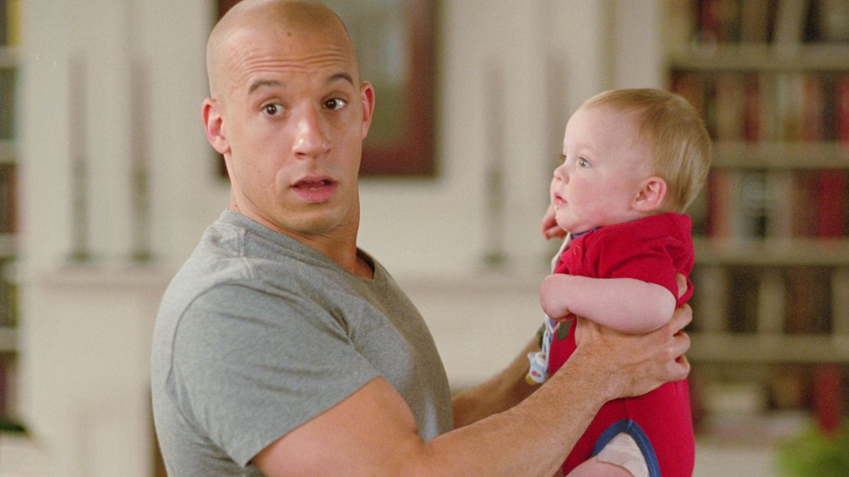 Vin Diesel with baby in The Pacifier (2005) - the familiar comedy set-up where an action tough guy is forced to play off kids