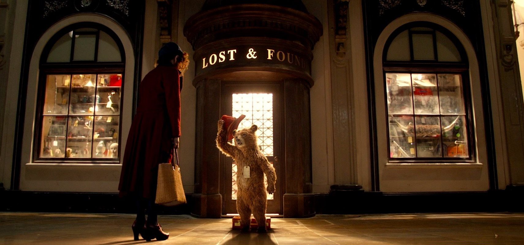 Sally Hawkins encounters Paddington outside the Lost and Found at Paddington Station in Paddington (2014)