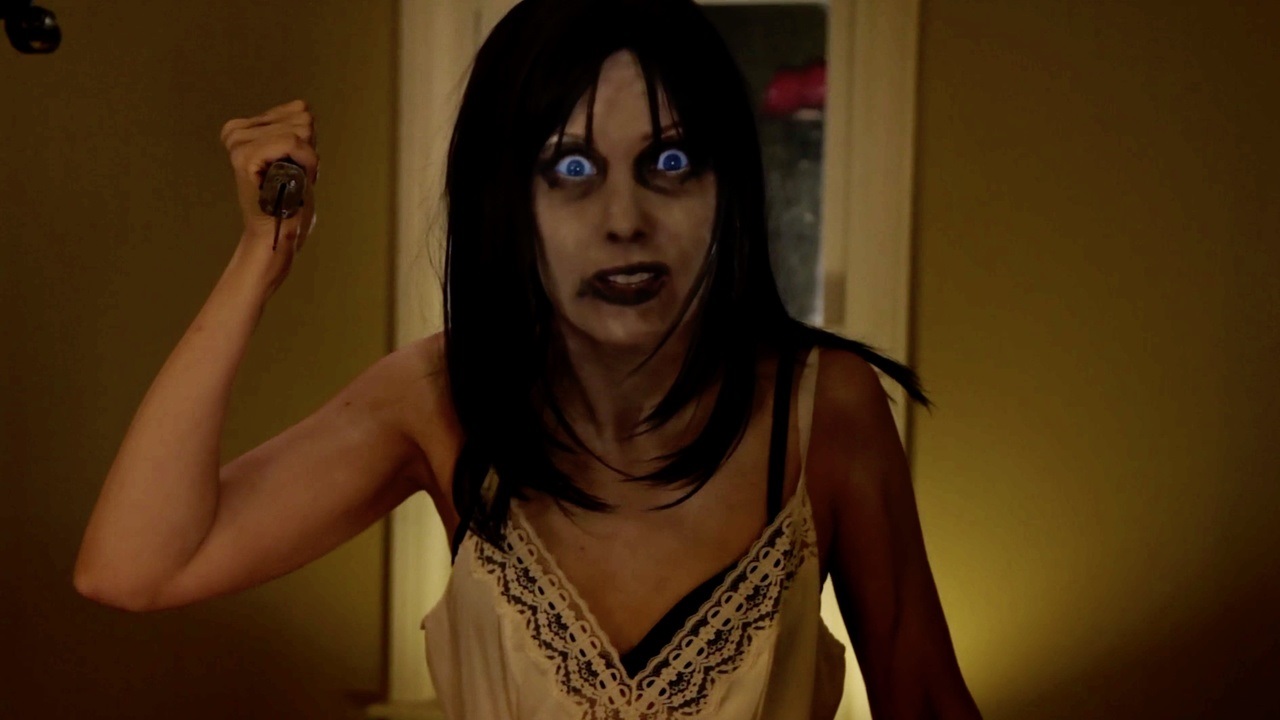 A possessed Laura Gilreath in Paranormal Asylum (2013)
