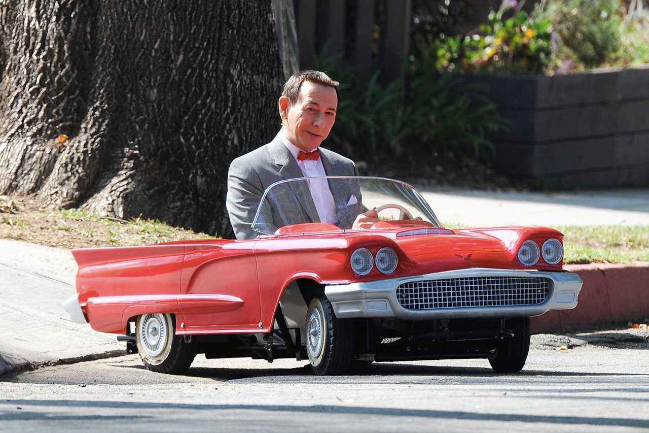 Pee-Wee Herman (Paul Reubens) and miniature car in Pee-Wee's Big Holiday (2016)