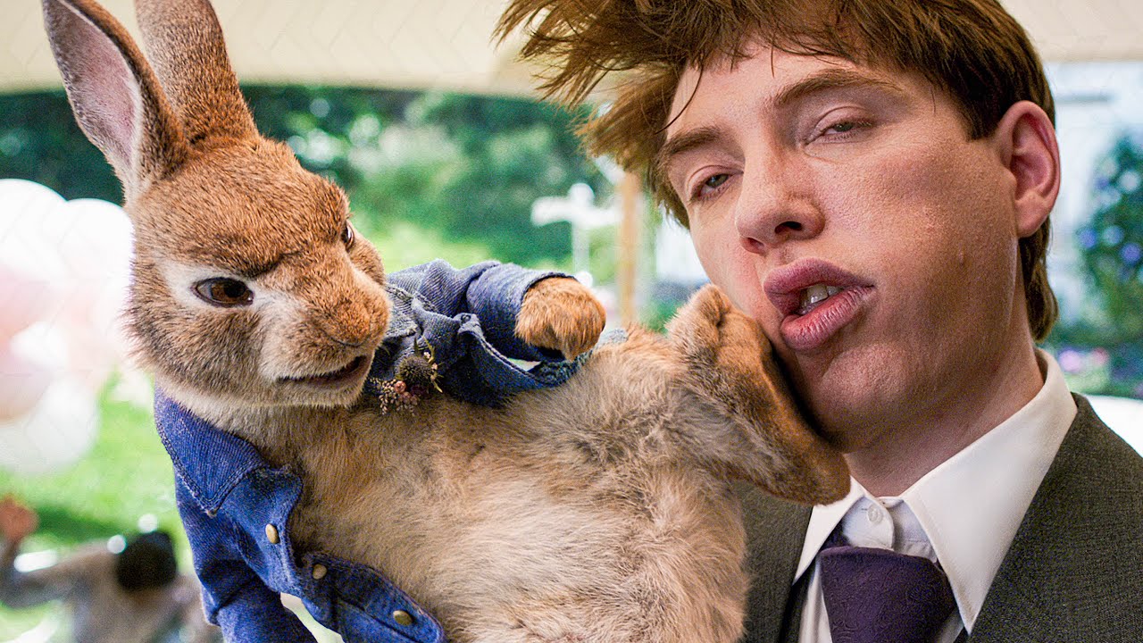 Domhnall Gleeson gets kicked in the face by Peter during the opening scene of Peter Rabbit 2 (2021)