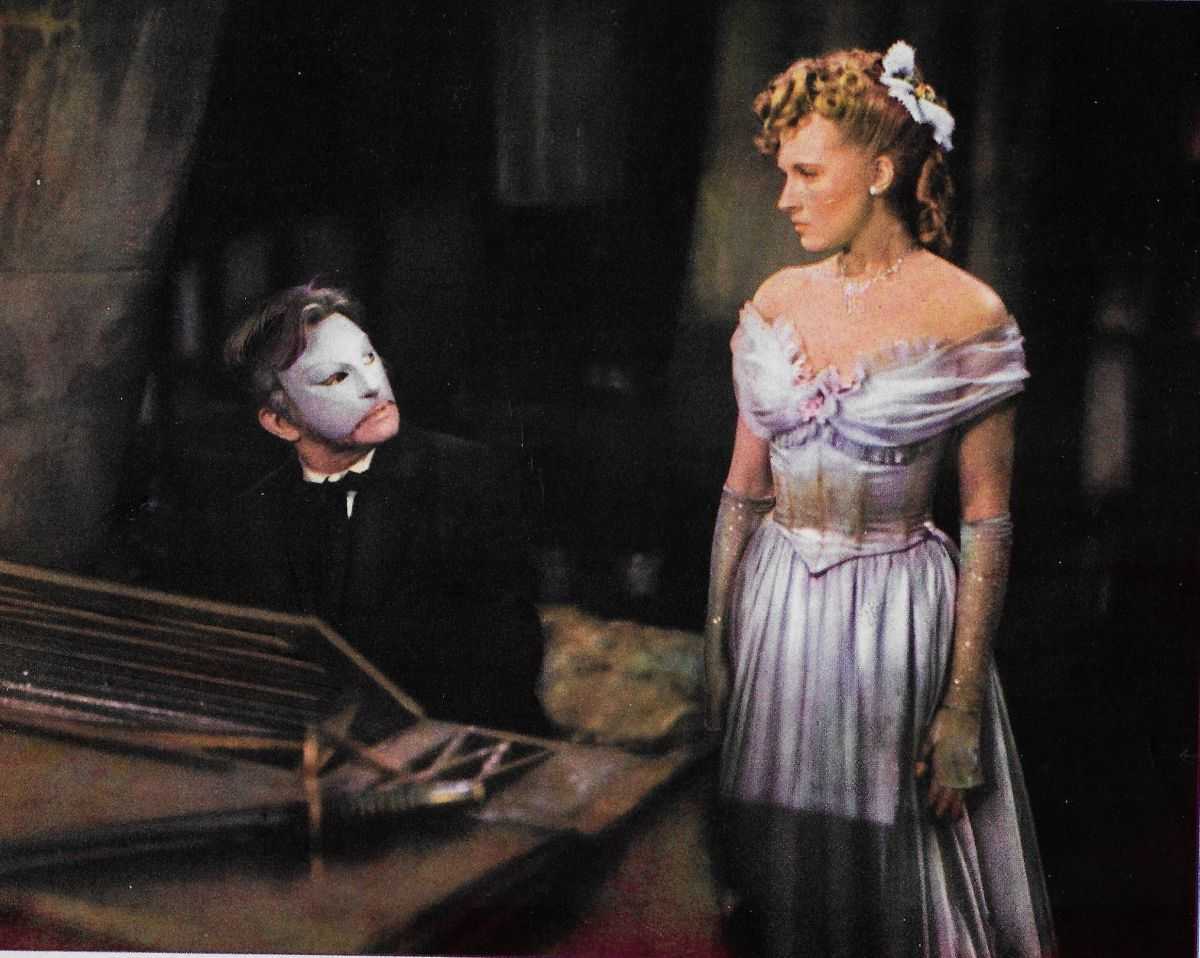 The Phantom (Claude Rains) takes Christine DuBois (Susanna Foster) for personal music tuition in Phantom of the Opera (1943)