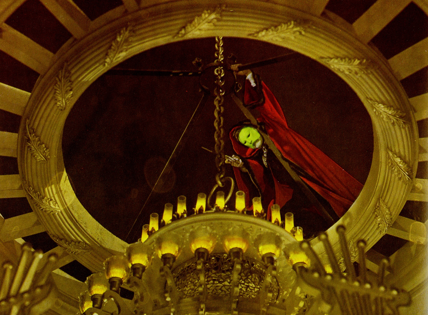 The Phantom (Claude Rains) cuts the chandelier in Phantom of the Opera (1943)