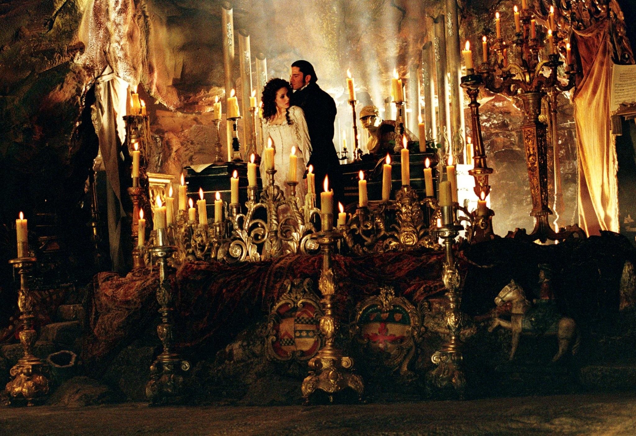 The Phantom (Gerard Butler) takes Christine Daae (Emmy Rossum) to his lair in The Phantom of the Opera (2004)