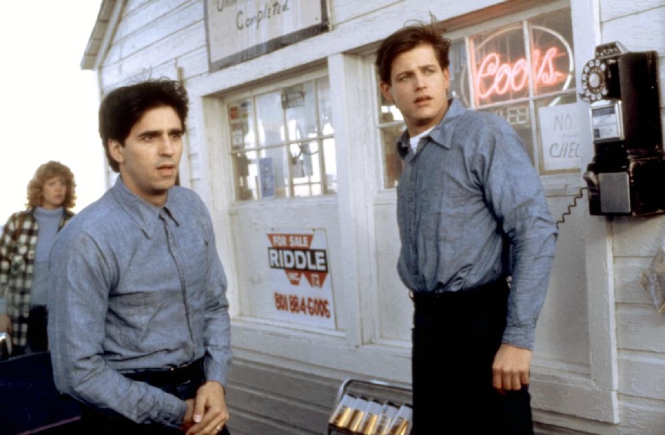 Bobby Di Cicco and Michael Paré as two sailors displaced in time with Nancy Allen in background in The Philadelphia Experiment (1984)