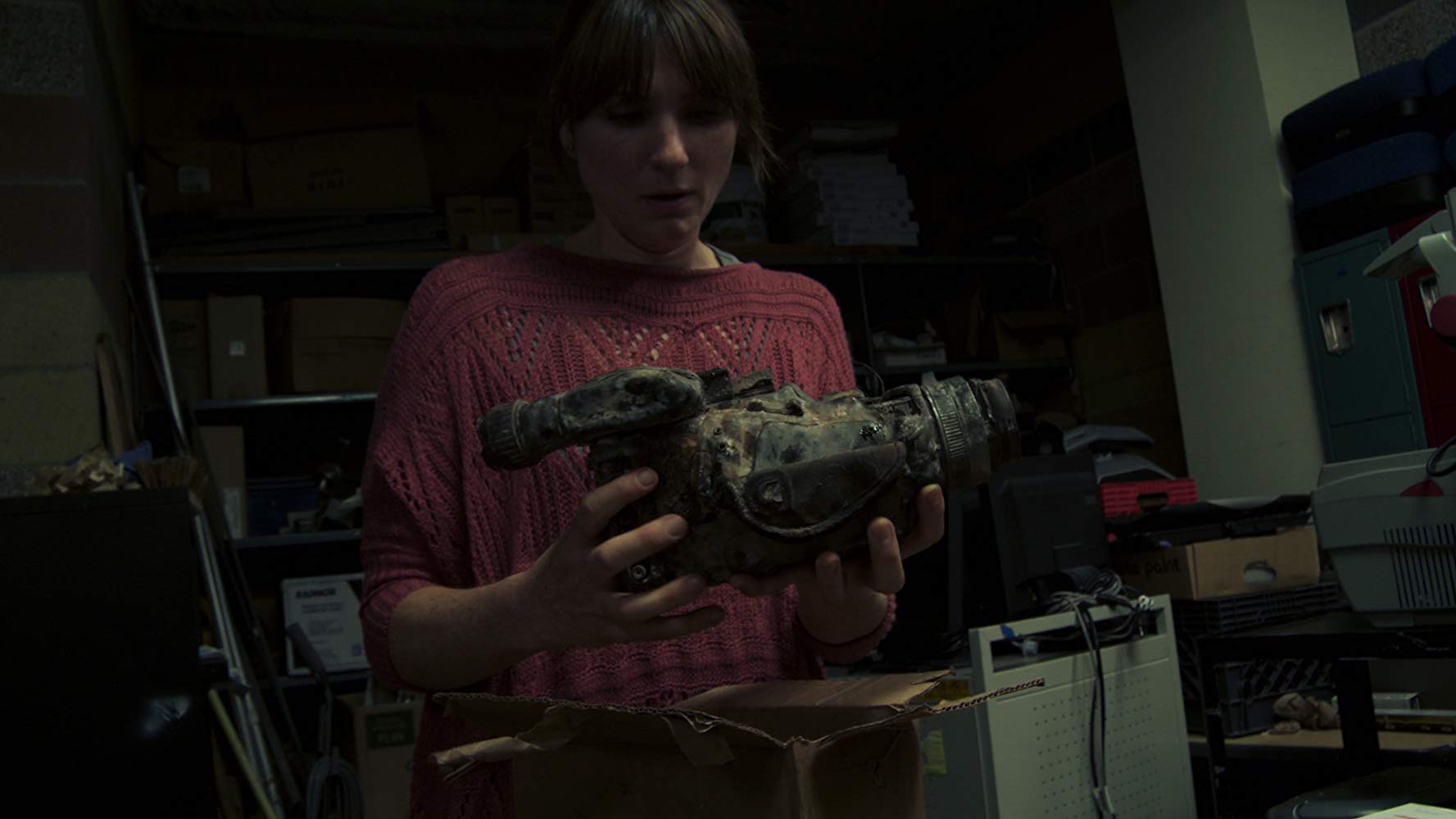 Florence Hartigan discovers a videocamera in Phoenix Forgotten (2017)