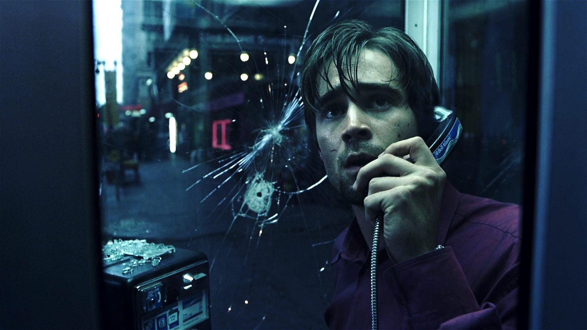 Colin Farrell trapped in a phone booth by a sniper in Phone Booth (2002)