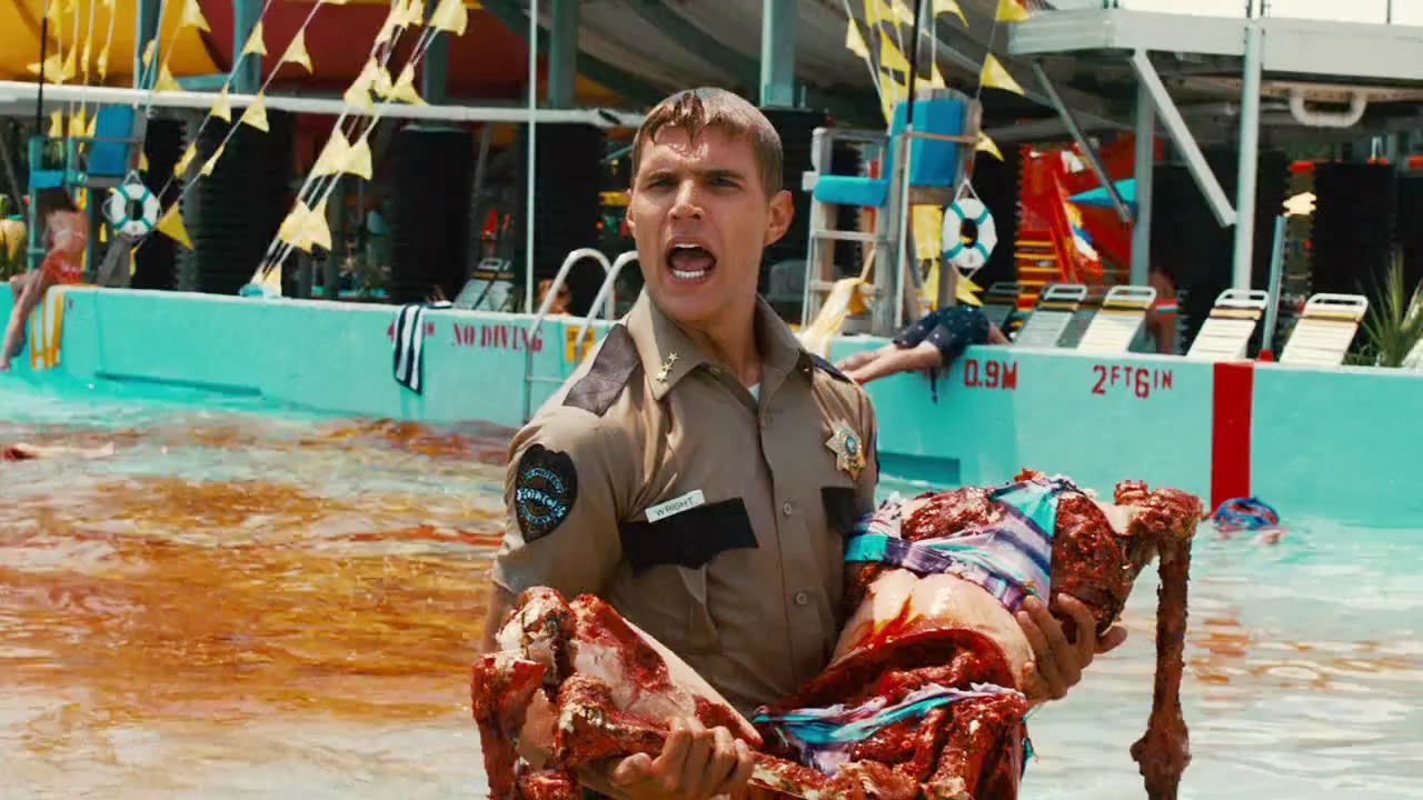 Deputy Chris Zylka with piranha-gored body in Piranha 3DD (2012)