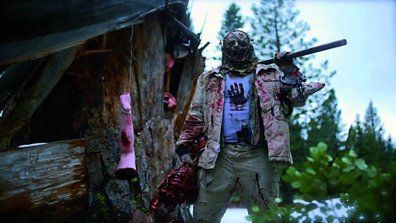 The Killer (Charlie Glackin) in Playing with Dolls (2015)