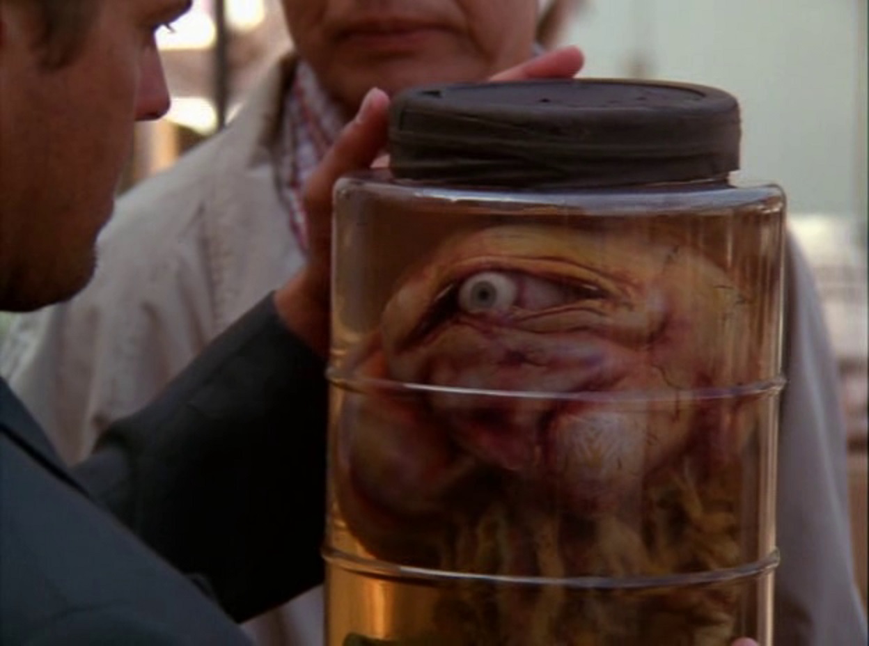 Evil mind-controlling creature in a jar in Possessed By the Night (1994) 