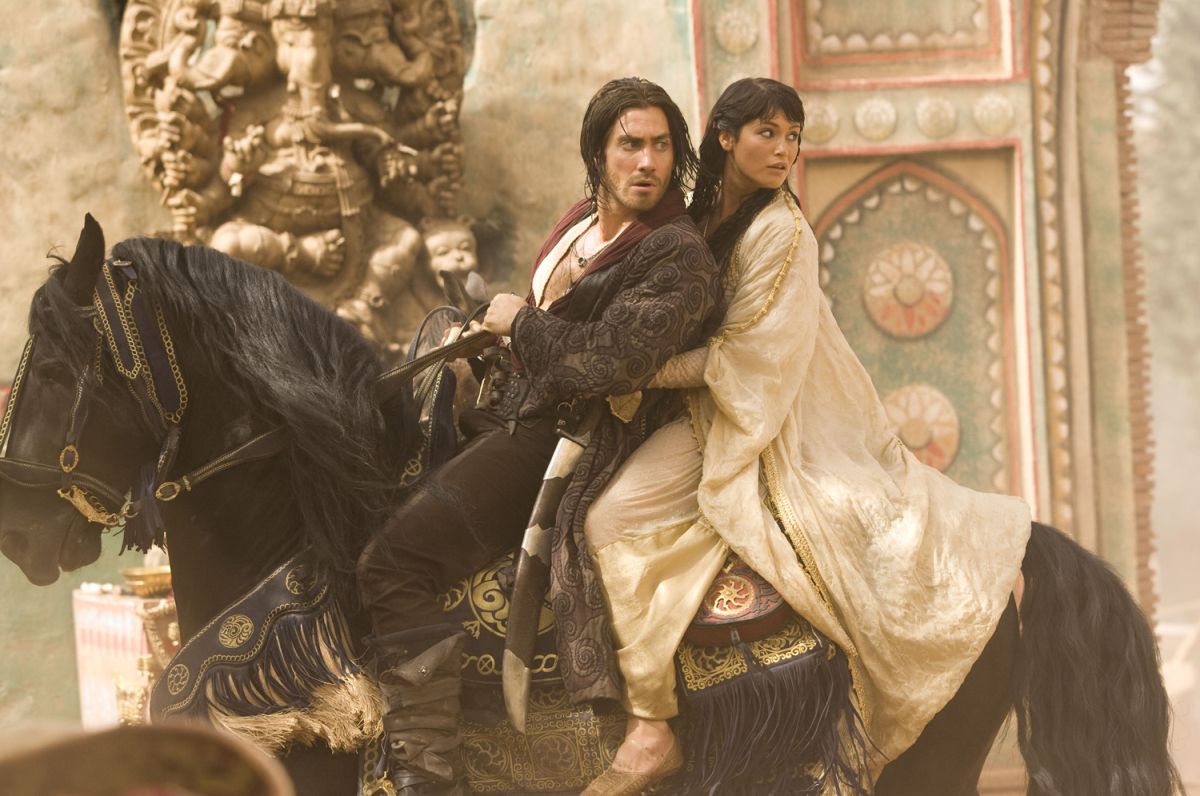 Prince Dastan (Jake Gyllenhaal ) and Princess Tamina (Gemma Arterton_) escape by horseback in Prince of Persia: The Sands of Time (2010)