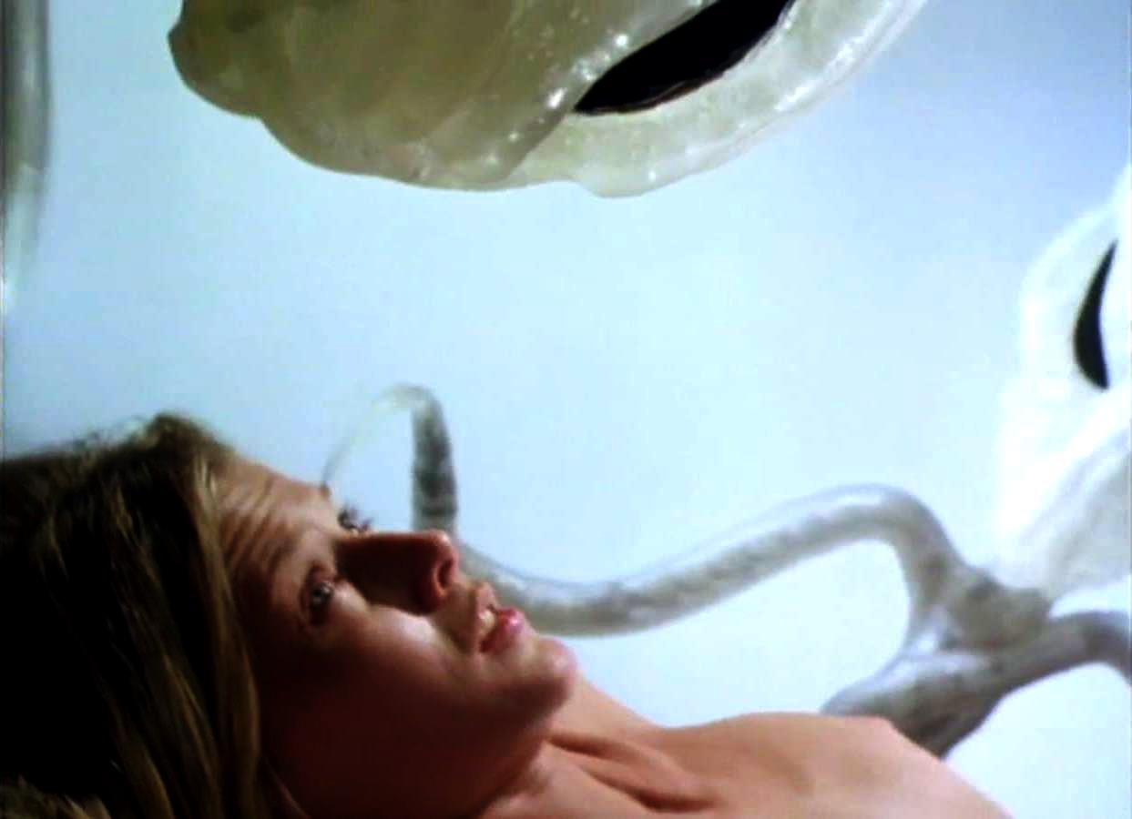 Jillian McWhirter undergoes alien impregnation in Progeny (1998)
