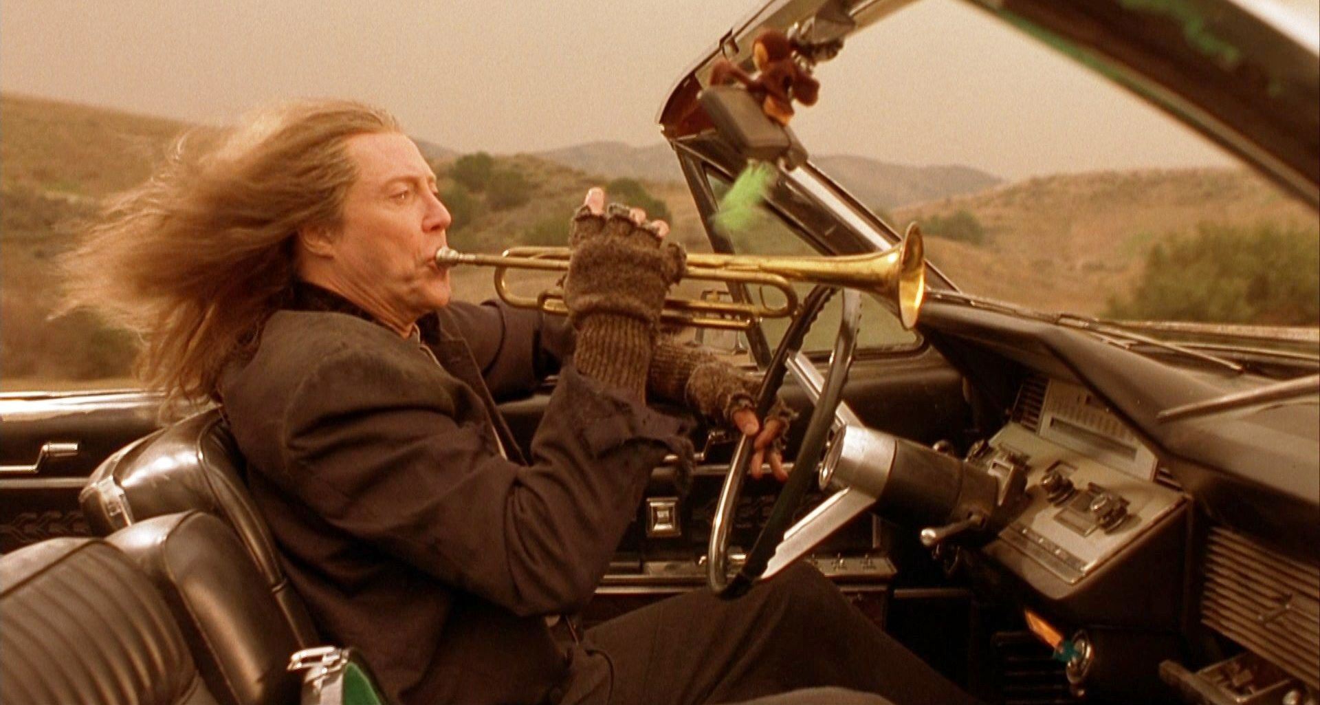 The angel Gabriel (Christopher Walken) playing the Last Trumpet while driving in The Prophecy 3: The Ascent (2000)