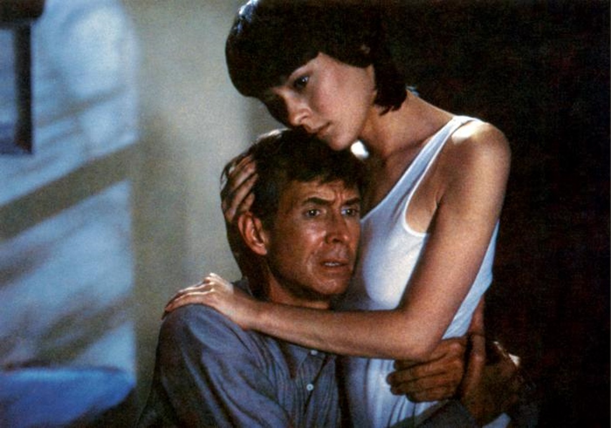 Mary Samuels (Meg Tilly) comforts Norman Bates (Anthony Perkins) in Psycho II (1983)