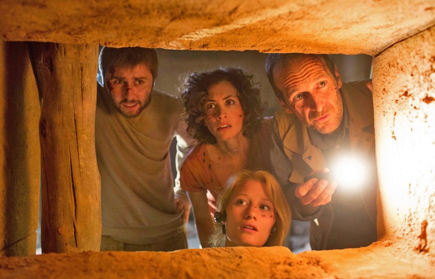 Venturing into an Ancient Egyptian tomb - (l to r) James Buckley, Christa-Marie Nicola, Ashley Hinshaw and Denis O’Hare in The Pyramid (2014)