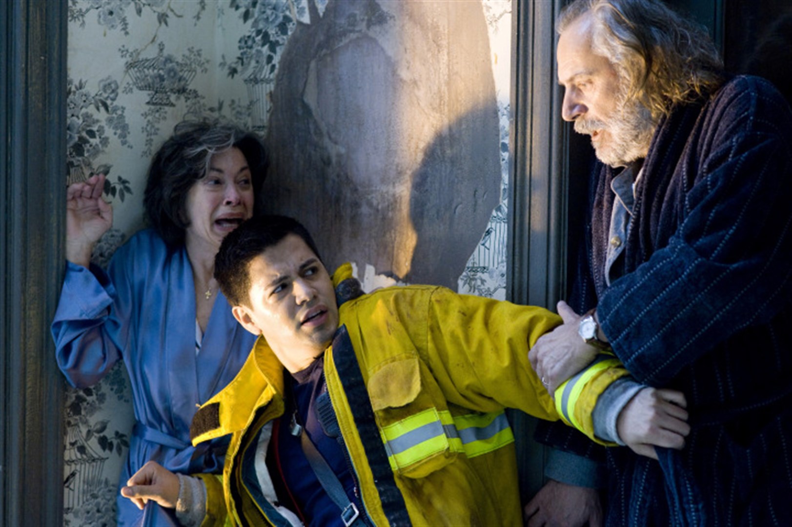 (l to r) Elaine Kagan and fireman Jay Hernandez recoil from Rade Serbedzija in Quarantine (2008)