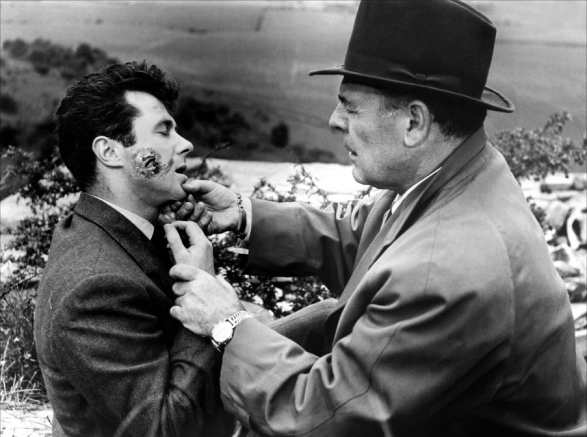 Professor Quatermass (Brian Donlevy) discovers his assistant Marsh (Bryan Forbes) is infected after touching a meteorite in Quatermass 2 (1957)