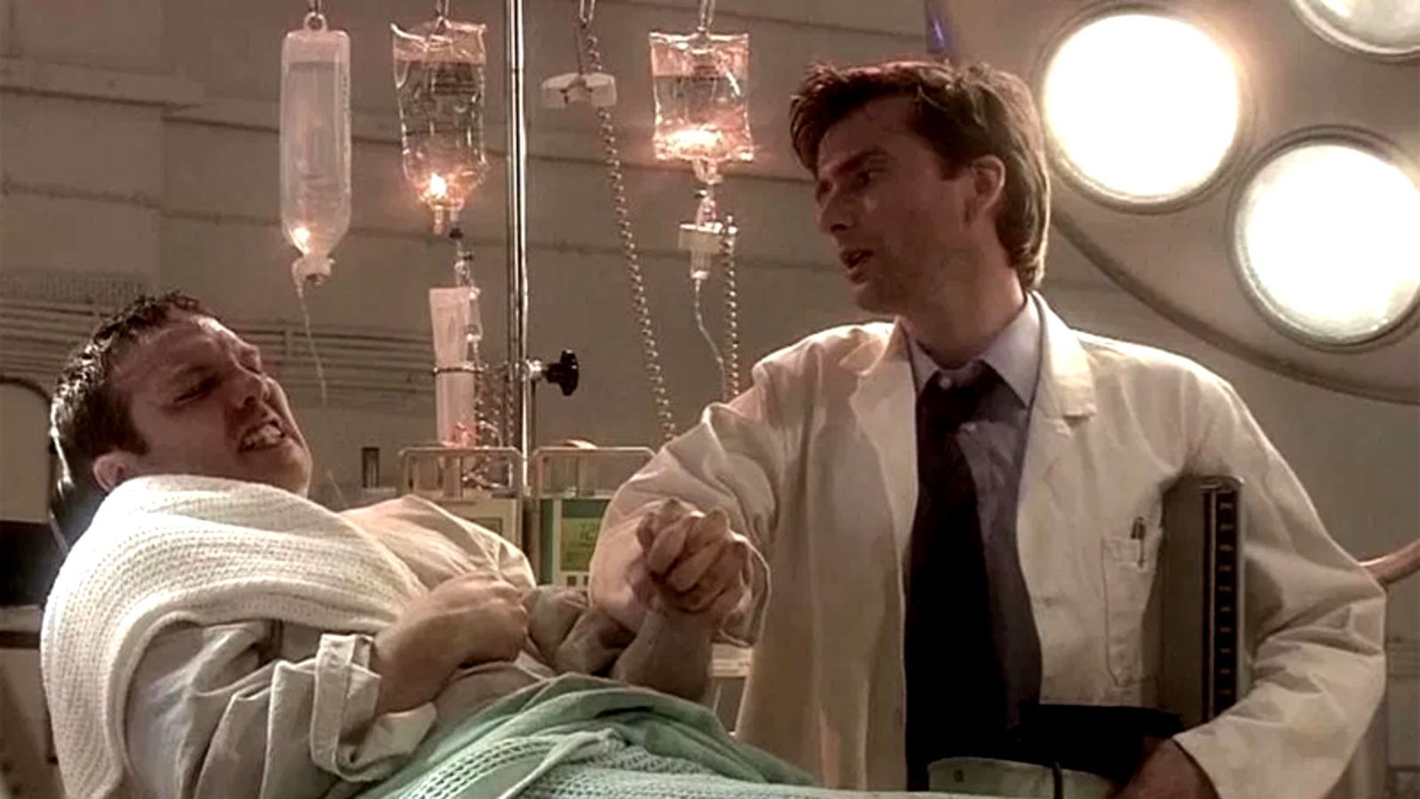 Infected astronaut Victor Carroon (Andrew Tiernan) and doctor David Tennant in The Quatermass Experiment (2005)