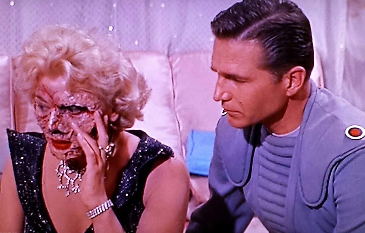 Captain Eric Fleming and Laurie Mitchell as the disfigured Queen Yllana in Queen of Outer Space (1958)