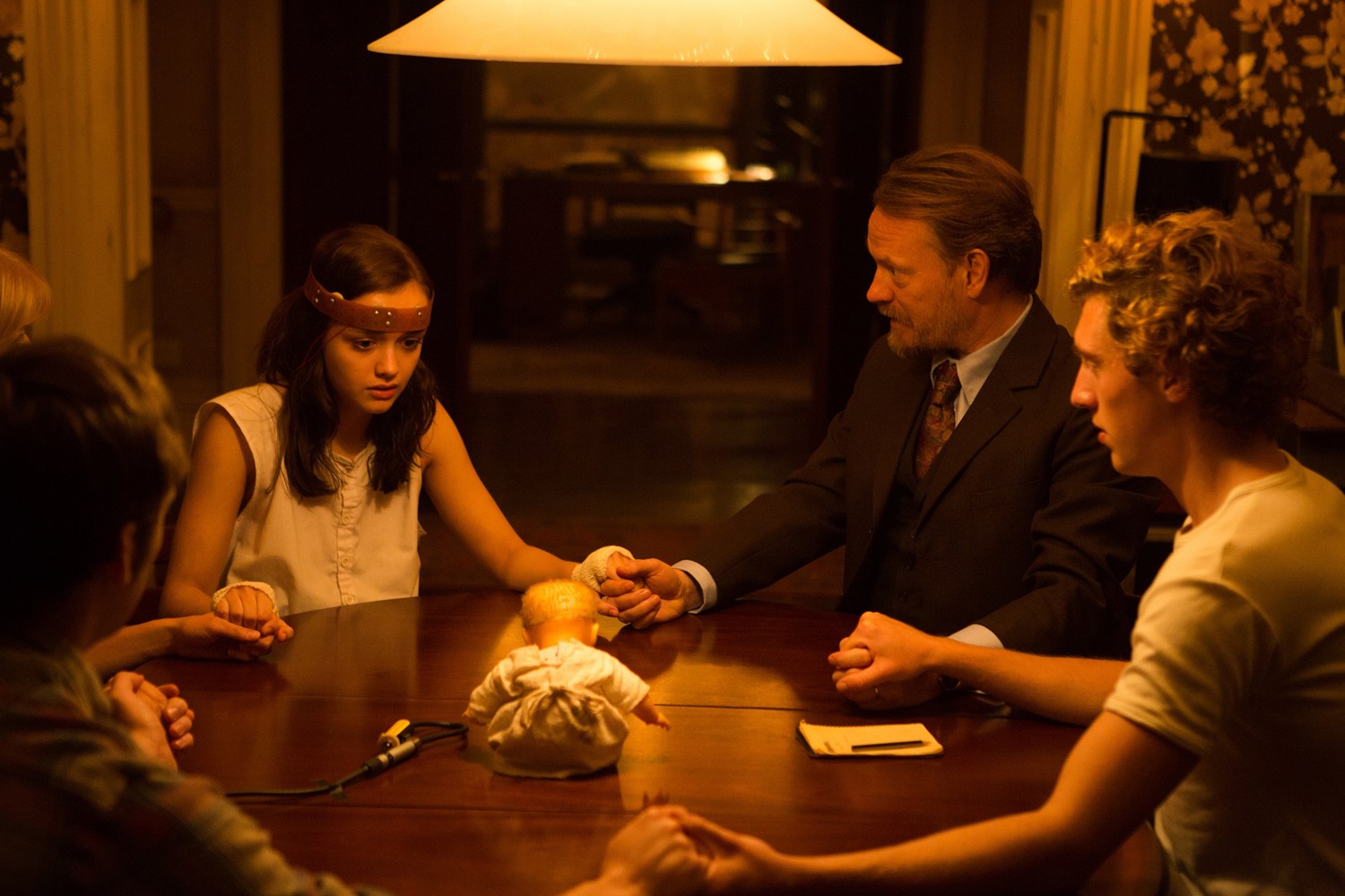 The seance - (l to r) Olivia Cooke, Jared Harris and Rory Fleck-Byrne in The Quiet Ones (2014)