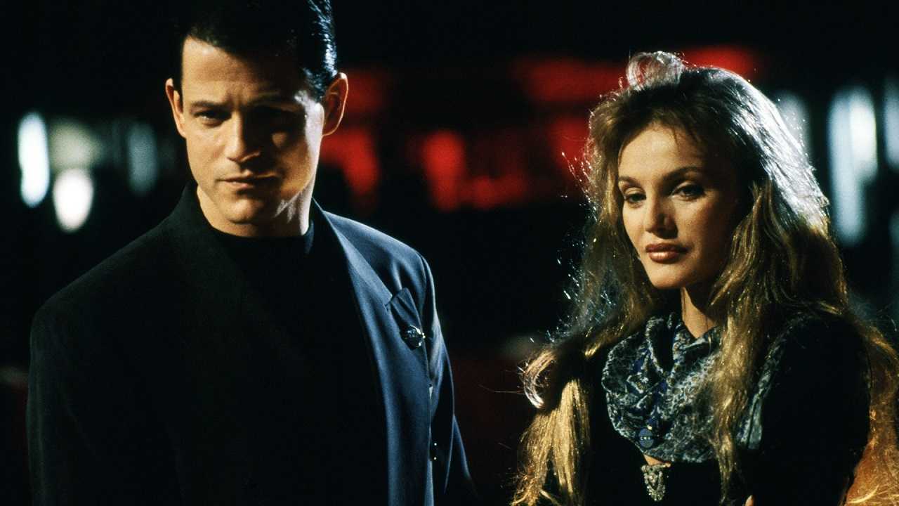 Michael Paré as The Anti-Christ Colin Gramercy with Arielle Dombasle in Raging Angels (1994)