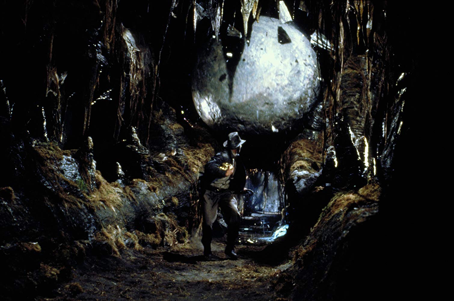 Harrison Ford on the run from boulder in Raiders of the Lost Ark (1981