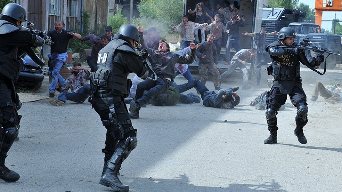 The soldiers fight off zombies in Re-Kill (2015)