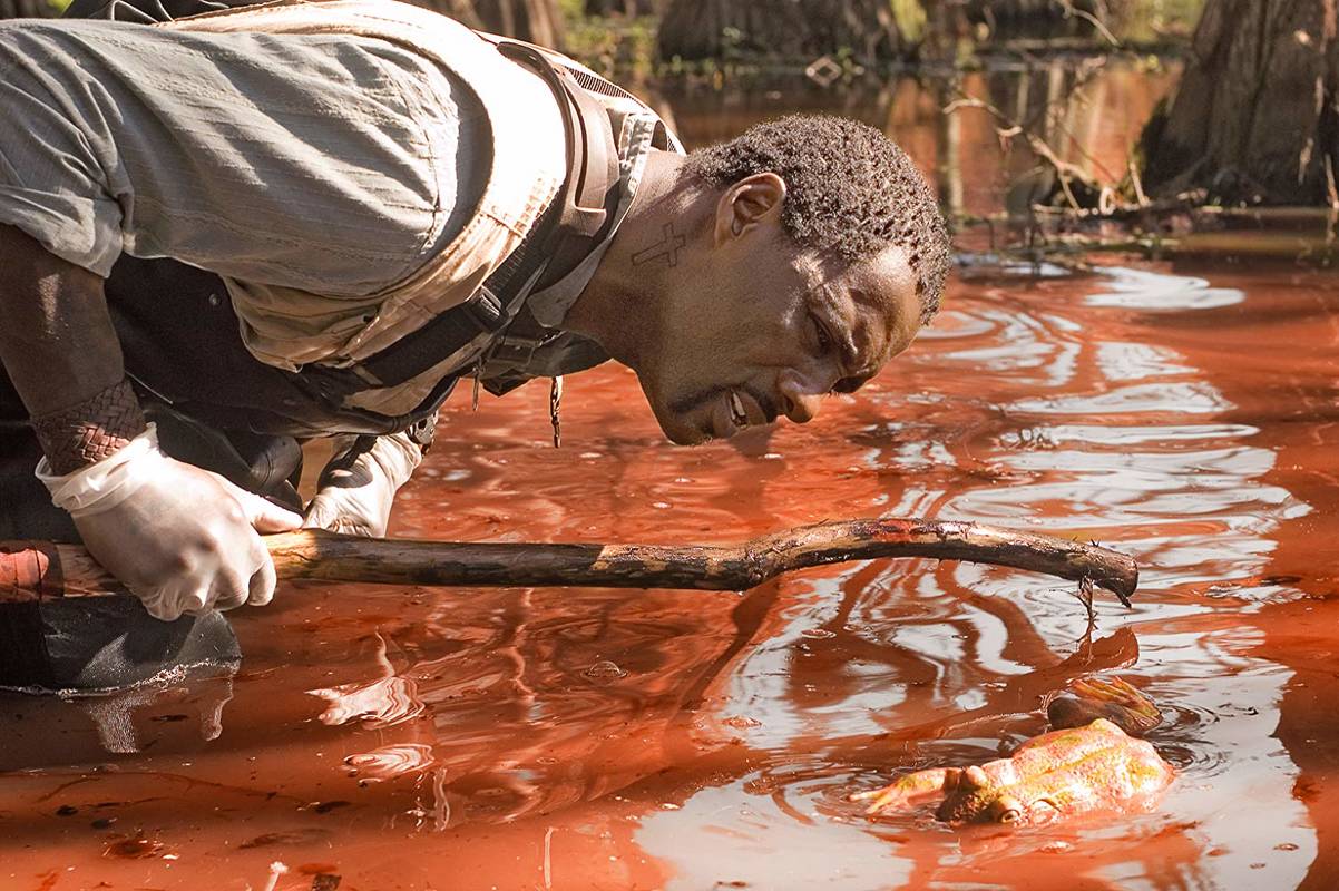 Idris Eba investigates a river of blood in The Reaping (2007)