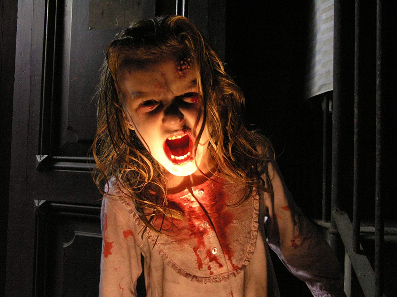 Zombie infected little girl (Claudia Silva) in [Rec] (2007)