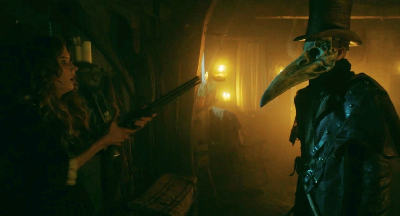 Charlotte Kirk confronts plague doctor in The Reckoning (2020) 