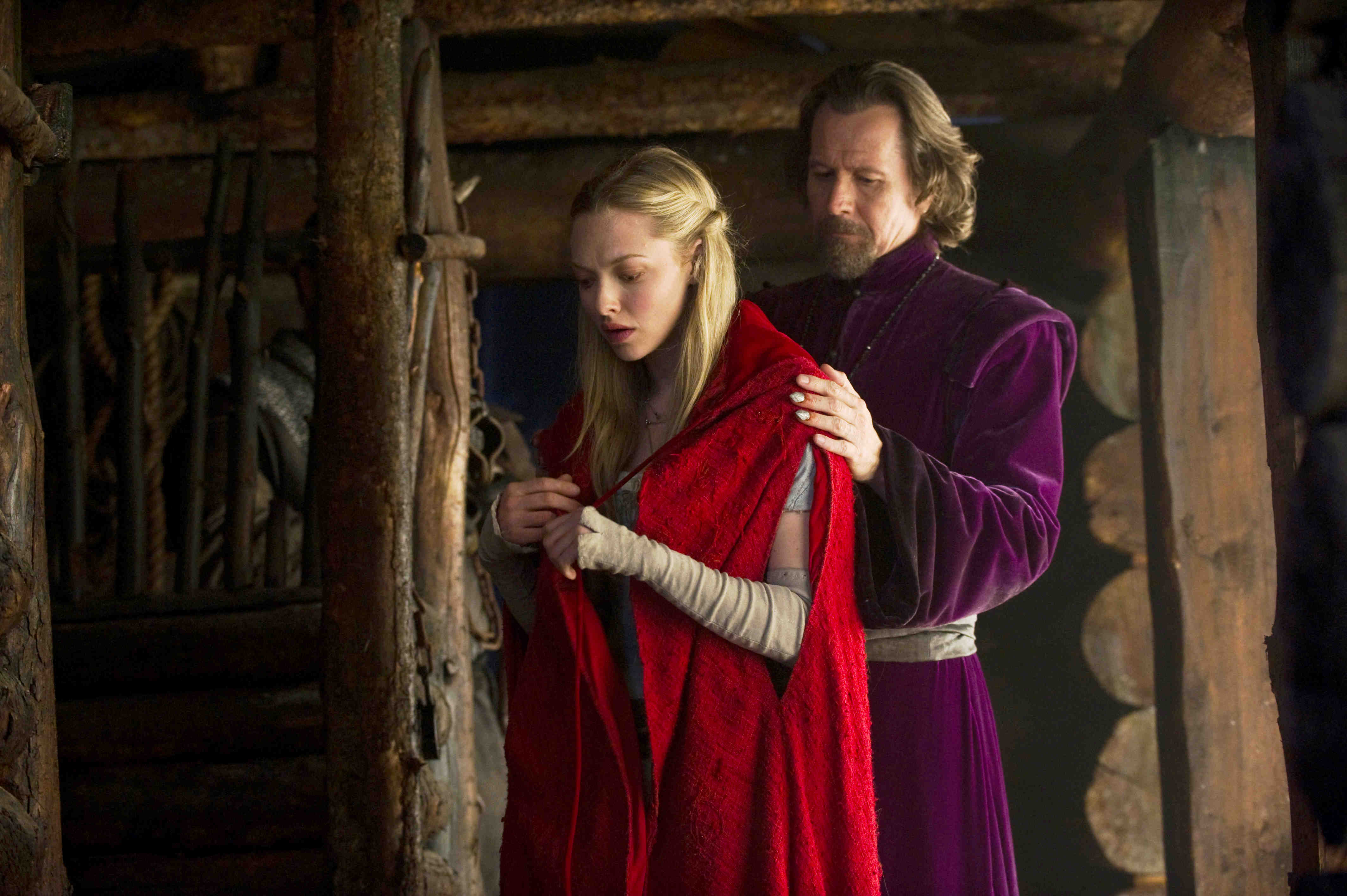 Valerie (Amanda Seyfried) and the monster hunter Father Solomon (Gary Oldman) in Red Riding Hood (2011)