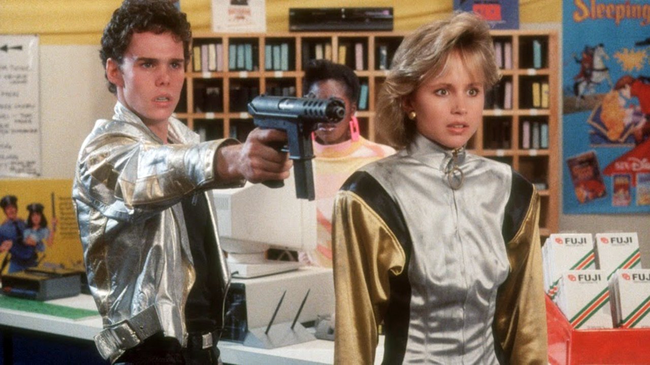 Kevin Dillon and Deborah Goodrich in Remote Control (1988)