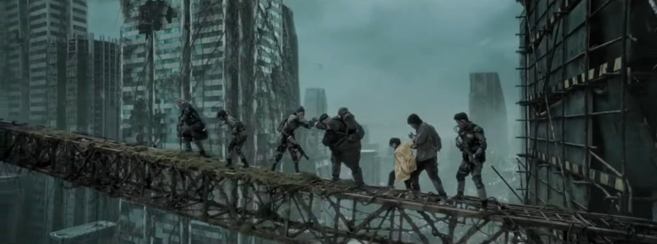 The team make their way across a bridge between skyscrapers Restart the Earth (2021)