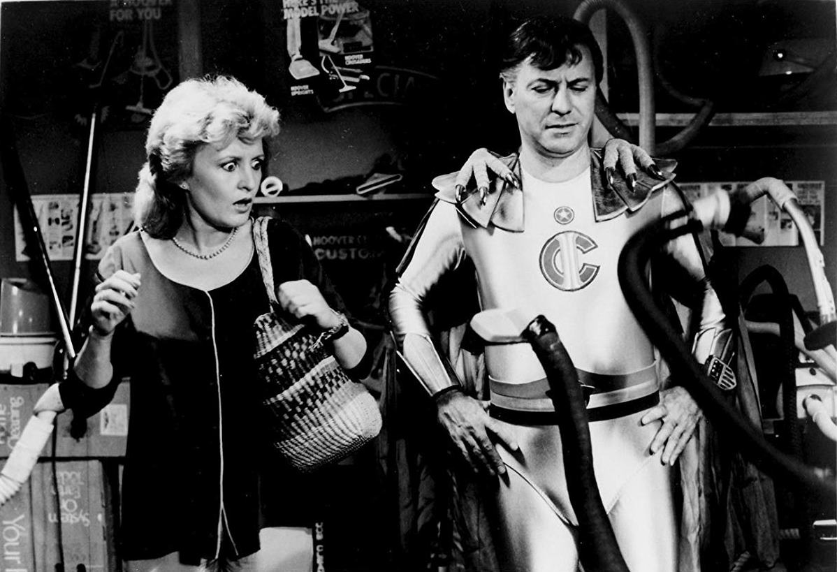 Reporter Kate Kitzpatrick and Captain Invincible (Alan Arkin) face killer vacuum cleaners in The Return of Captain Invincible (1983)