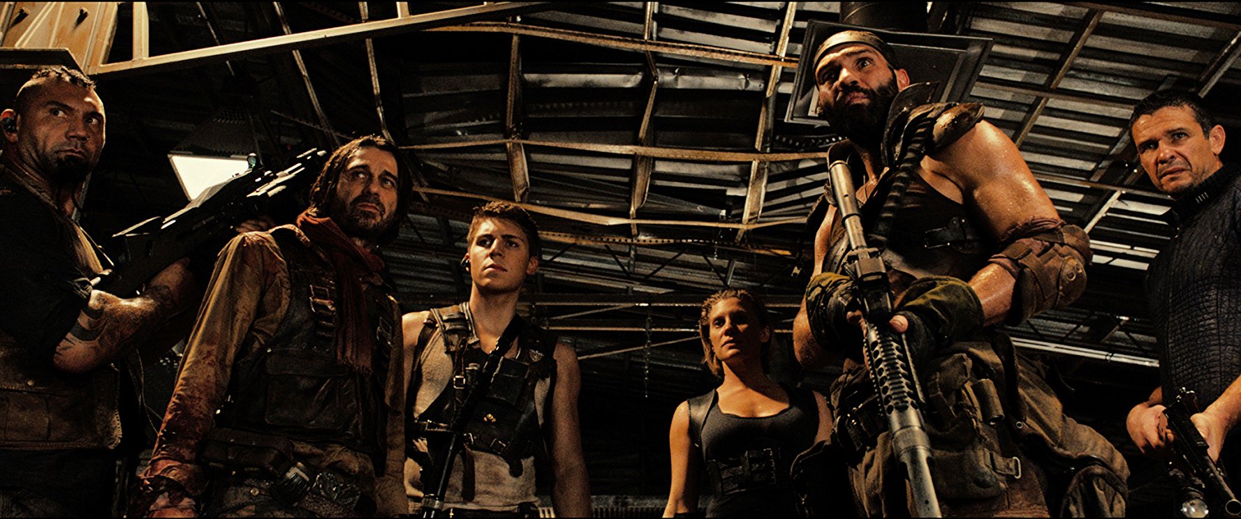 The pursuing mercenaries - (l to r) Dave Bautista, Nolan Gerard Funk, Jordi Mollà, Katee Sackhoff, Conrad Pla and Matt Nable in Riddick (2013)