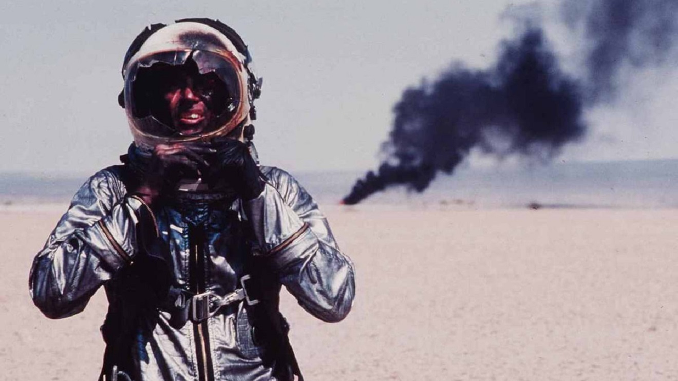 Chuck Yeager (Sam Shepard) walks away from a crash in The Right Stuff (1983)