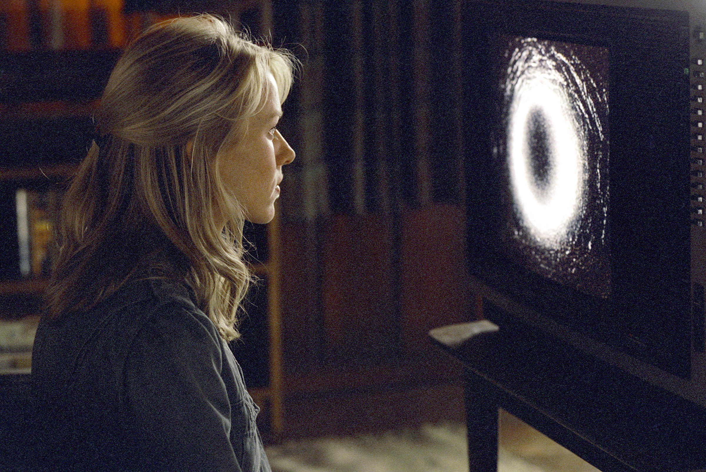 Naomi Watts sits down to watch the cursed videotape in The Ring (2002)