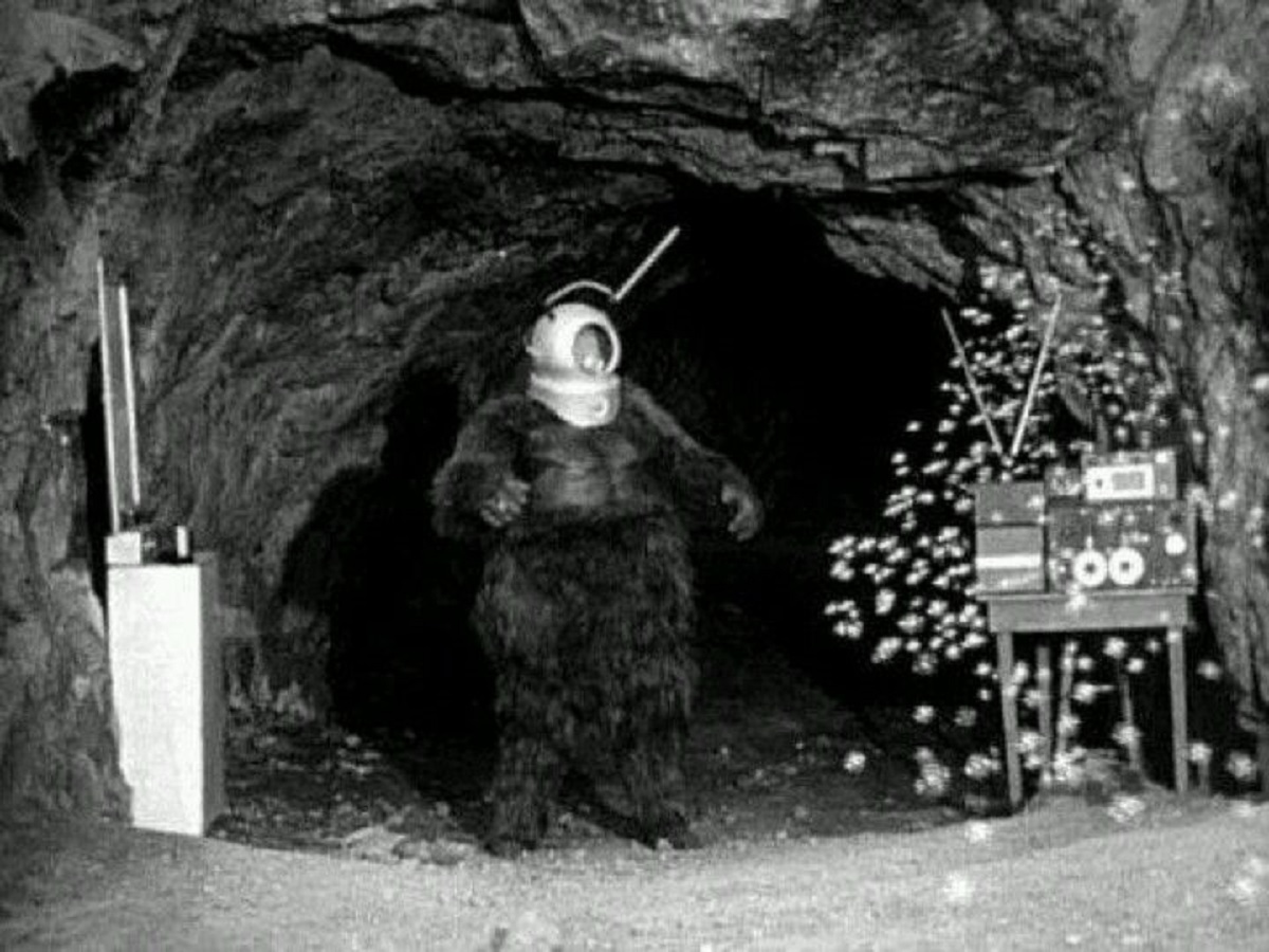 Ro-Man (George Barrows) in his cave with the Automatic Billion Bubble Machine in Robot Monster (1953)