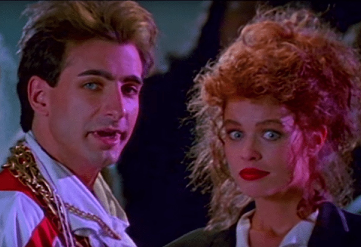 Vampire teenager Ralph (Dean Cameron) and his reincarnated lady love Mona (Tawny Feré) in Rockula (1990)