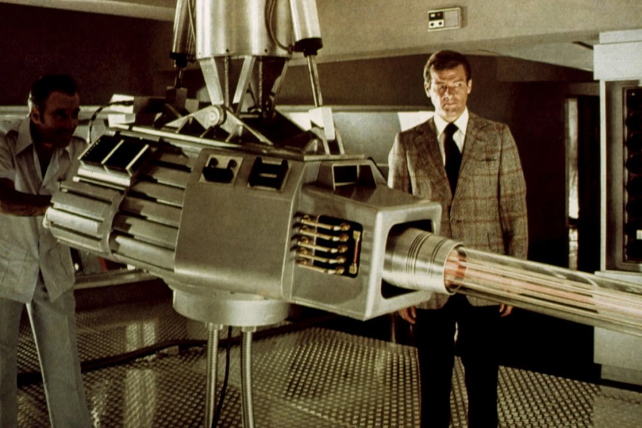 Scaramanga (Christopher Lee) demonstrates the Solex Agitator laser to James Bond (Roger Moore) in The Man With the Golden Gun (1974)