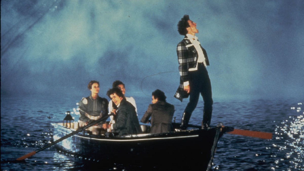 Hugh Grant, Jose Luis Gomez, Valentina Pelka, Elizabeth Hurley and Lizzy McInnerny go boaing on Lake Geneva in Rowing with the Wind (1988)