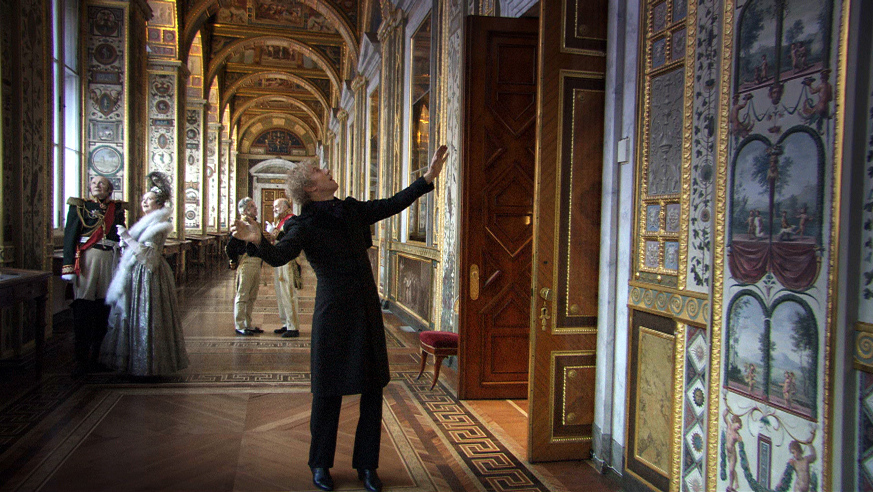 The Marquis de Custine (Sergei Dreiden) guides the narrator through the St Petersburg Hermitage Museum in Russian Ark (2002)