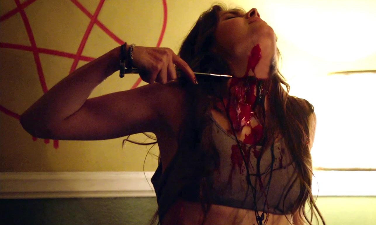 Sophie Dalah cuts her own throat in a ritual in Satanic (2016)