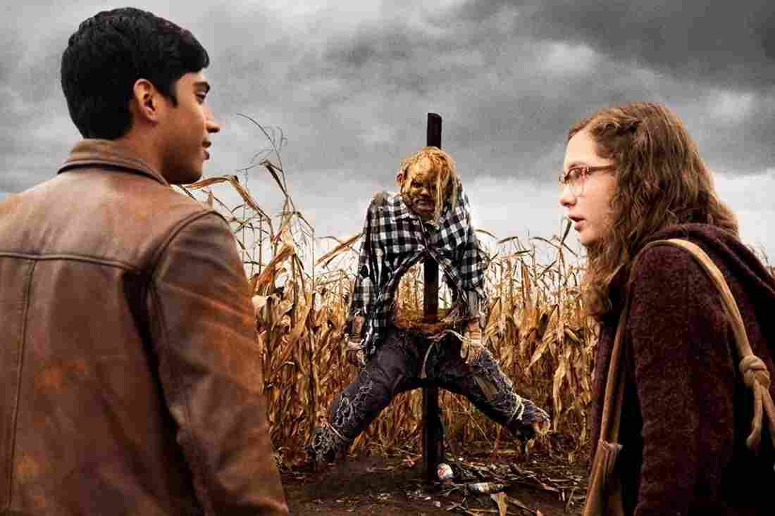 Michael Garza and Zoe Colletti with the scarecrow in Scary Stories to Tell in the Dark (2019)