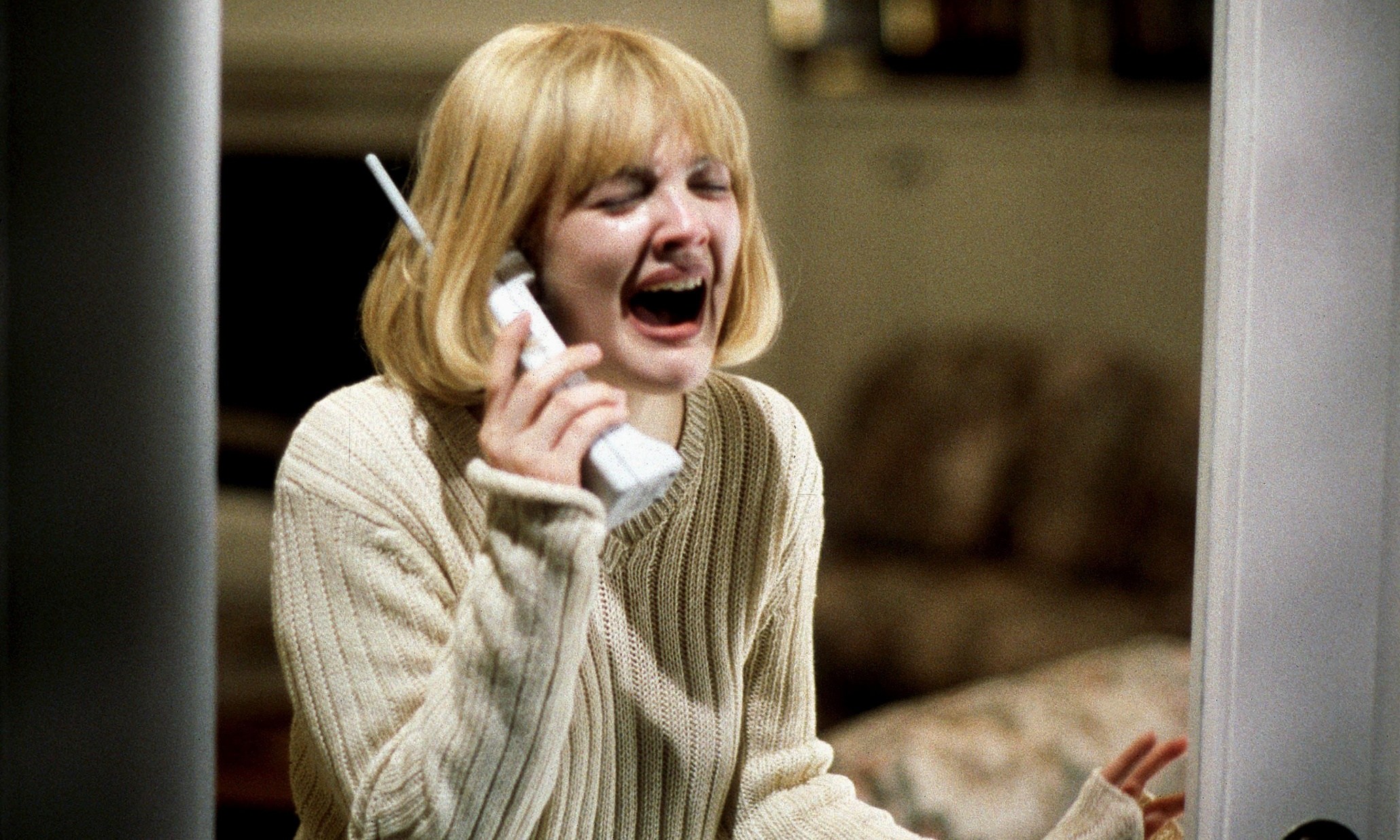 Drew Barrymore answers the phone in the classic opening scene in Scream (1996)