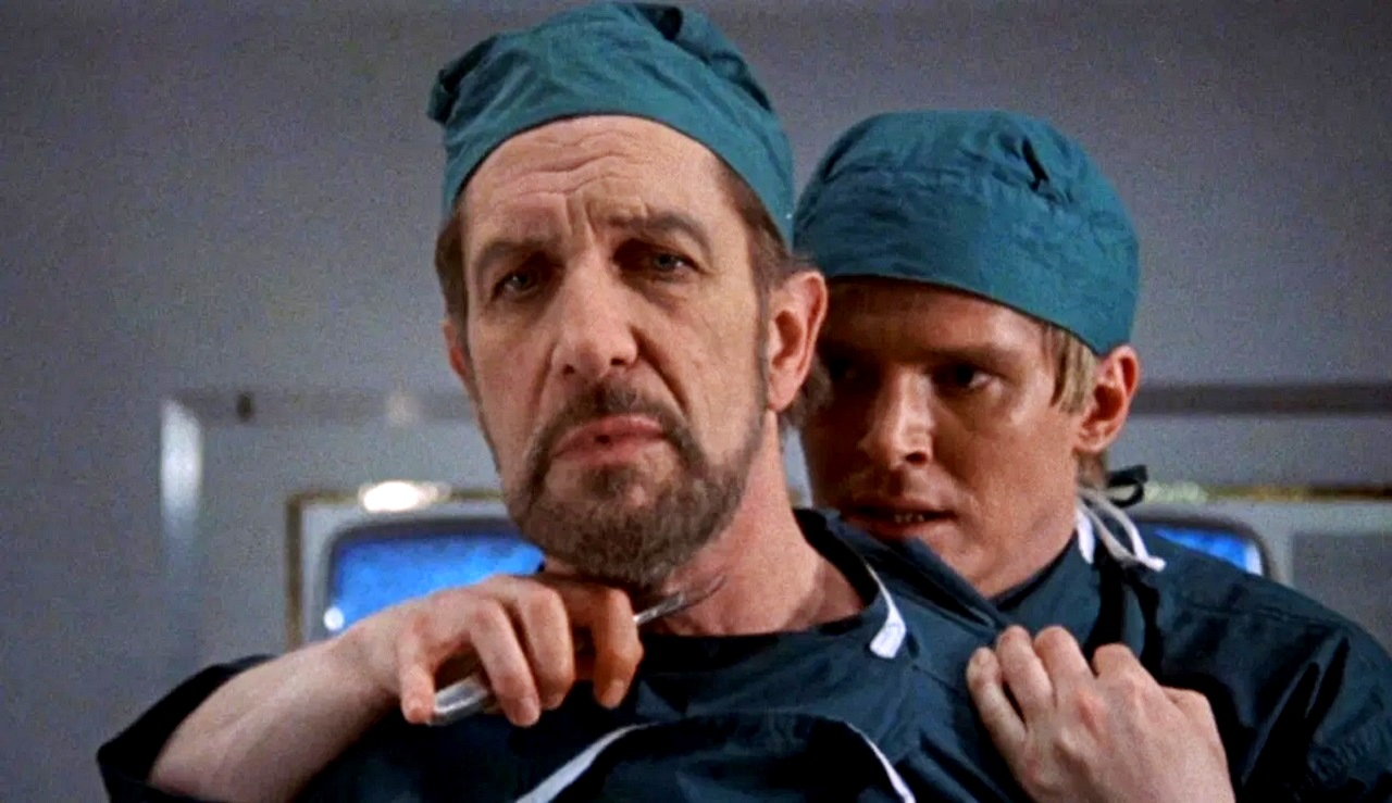 Dr Browning (Vincent Price) threatened by Christopher Matthews in Scream and Scream Again (1970)